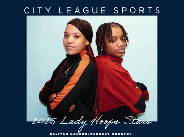 two female basketball players standing back to back